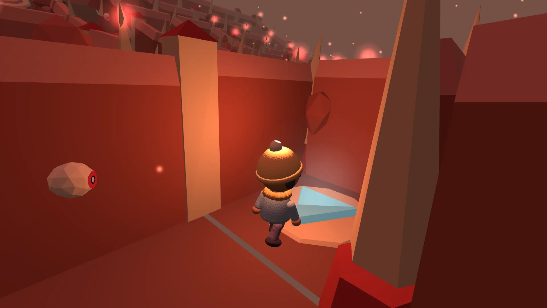 The maze walls have turned red. An eye floats beside the character.